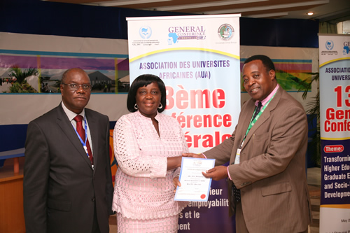 prof_tolly_mbwette_acde_president_presenting_goodwill_ambassador_certificate_to__mrs._alice_lamptey_during_the_recently_held_aau_conference_in_libreville_gabon